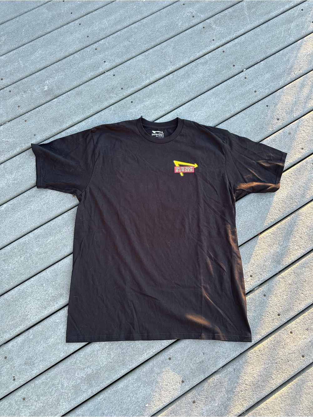 Black Short-Sleeve Tee with Yellow & Red Chest Logo -